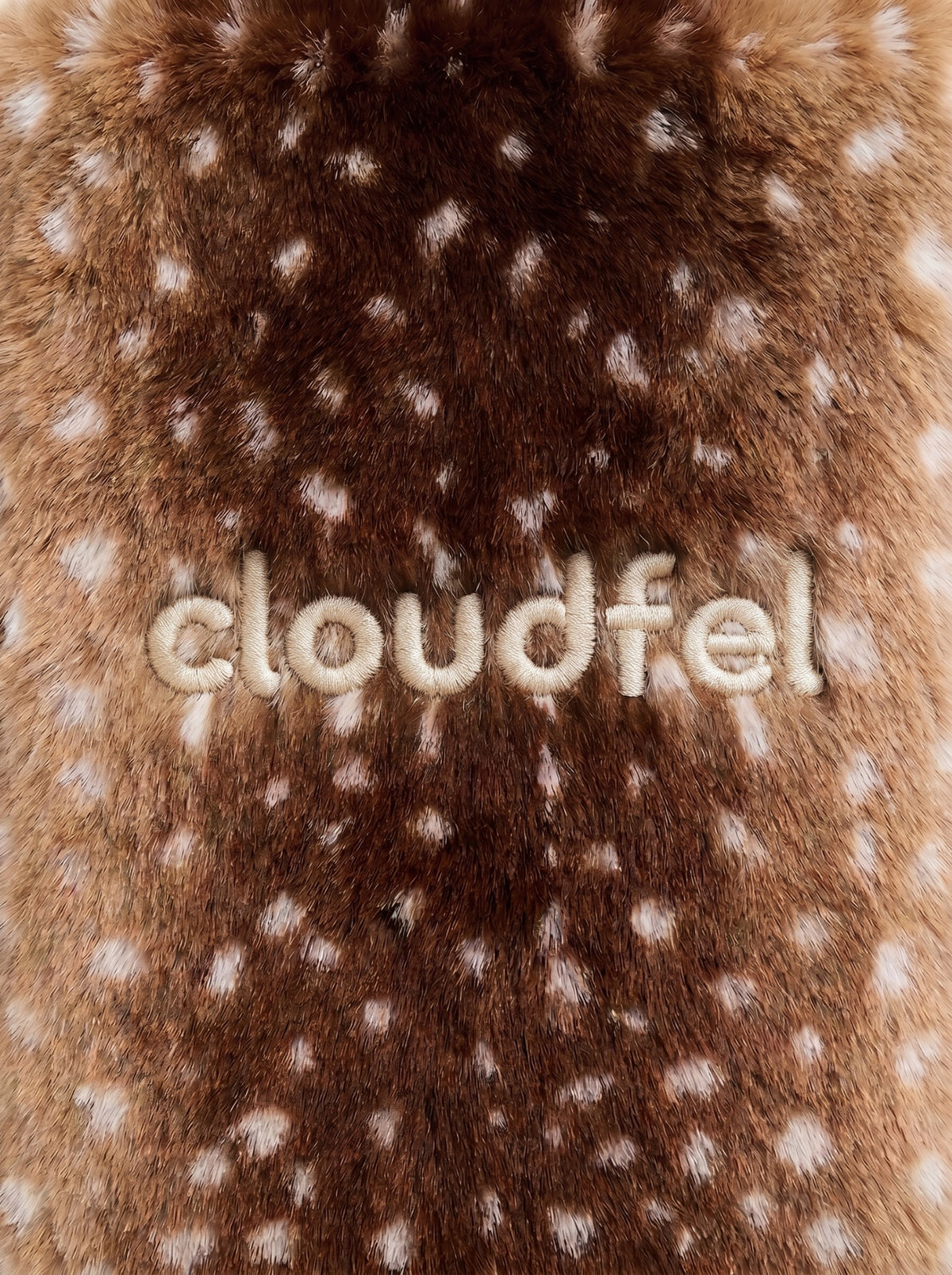 CLOUDFEL embroidery in cream thread on spotted brown fur